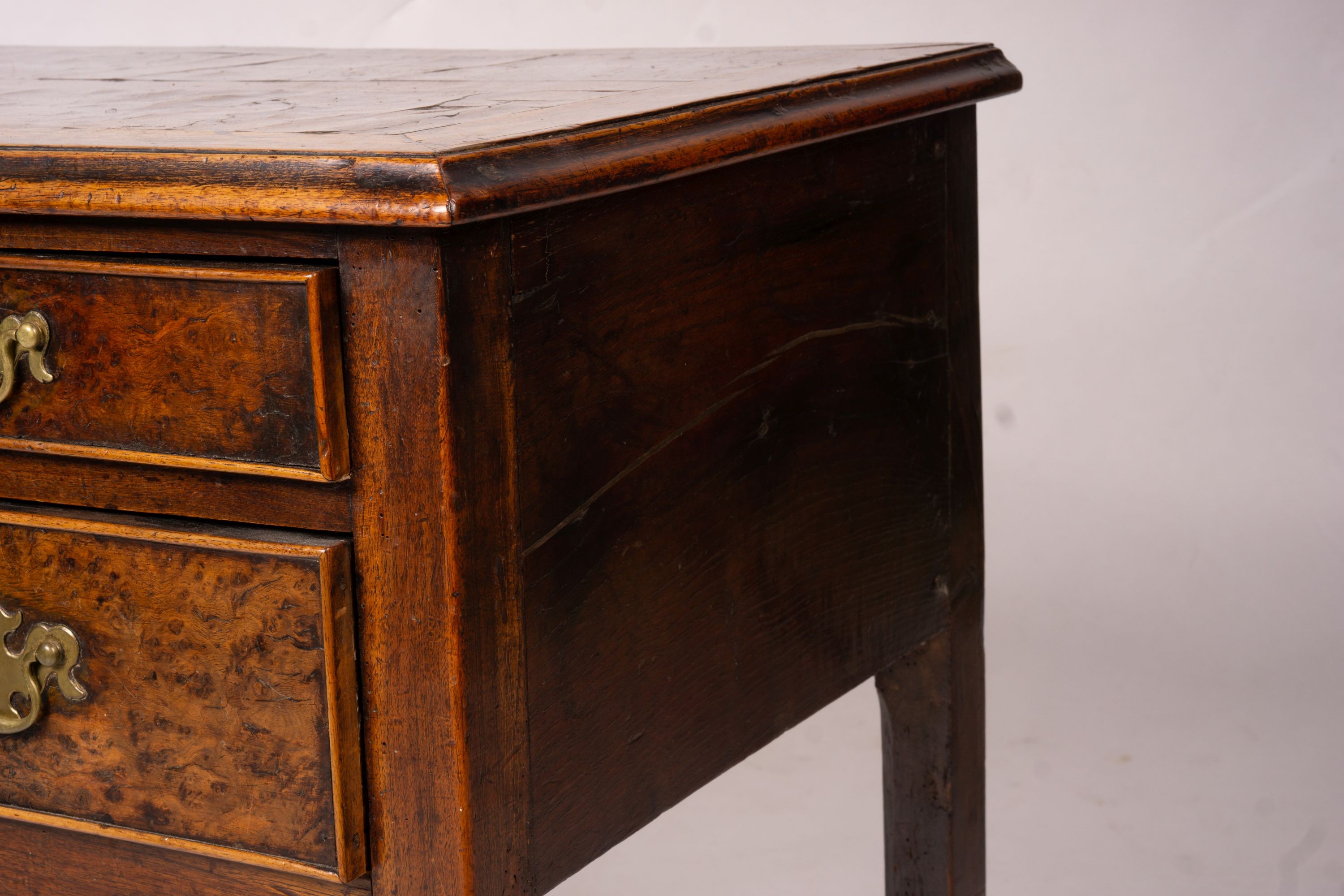 A George III oak and pollard oak three drawer side table, width 83cm, depth 51cm, height 72cm